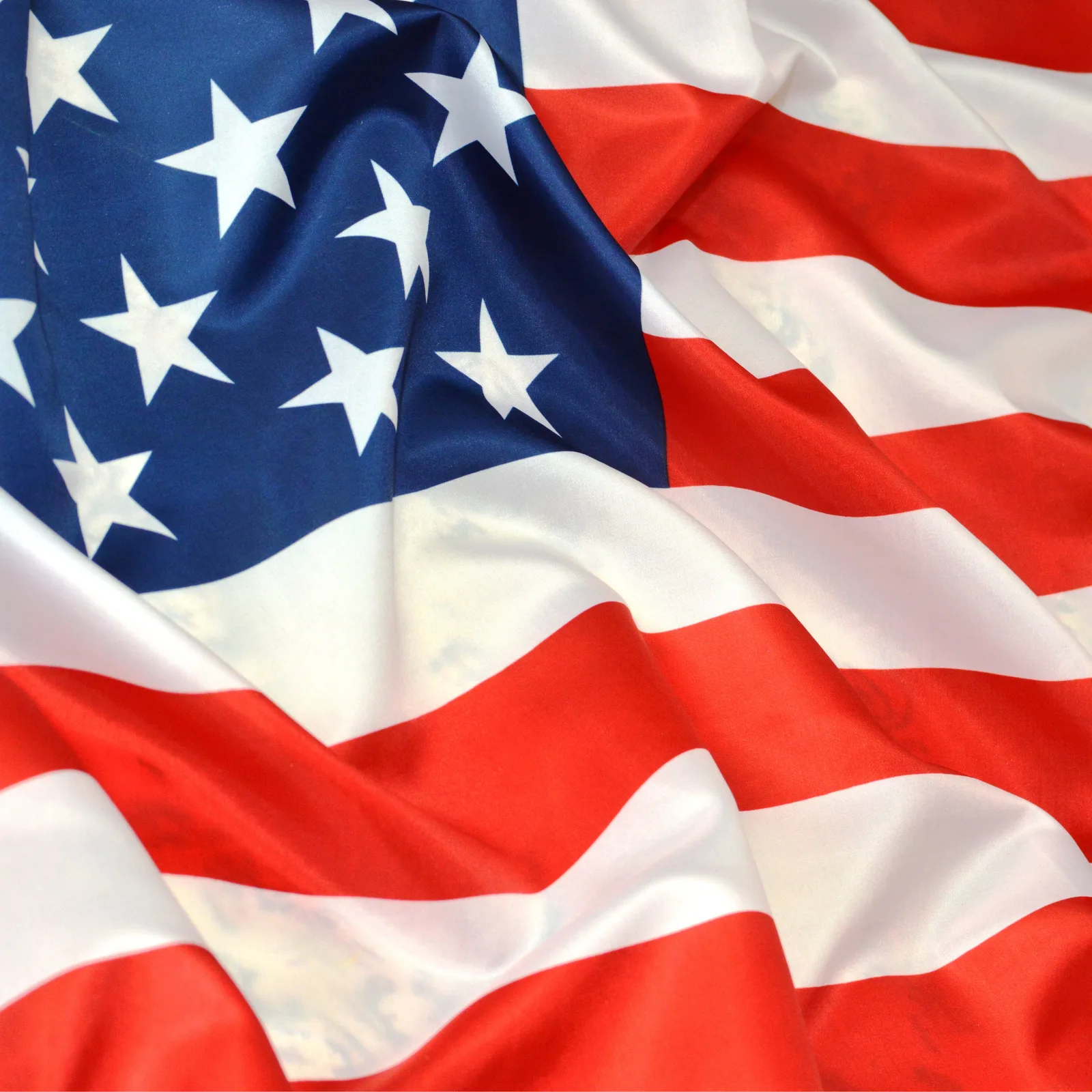 As an Active SAM.gov Registered Entity, Leadous Expands Public-Sector Support — Leadous Articles & Insights Close-up of the United States flag waving in the wind.